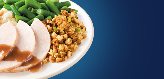 Turkey, stuffing, green beans on a plate
