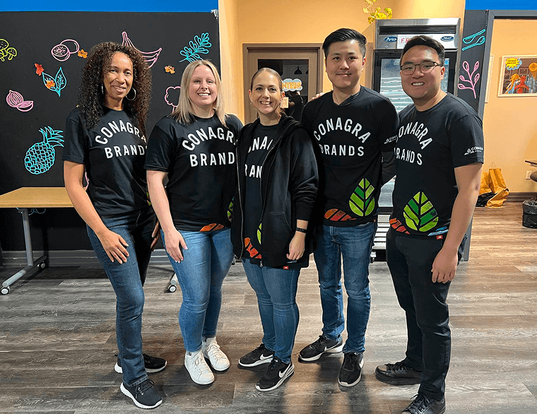 Group of employees standing and facing the camera